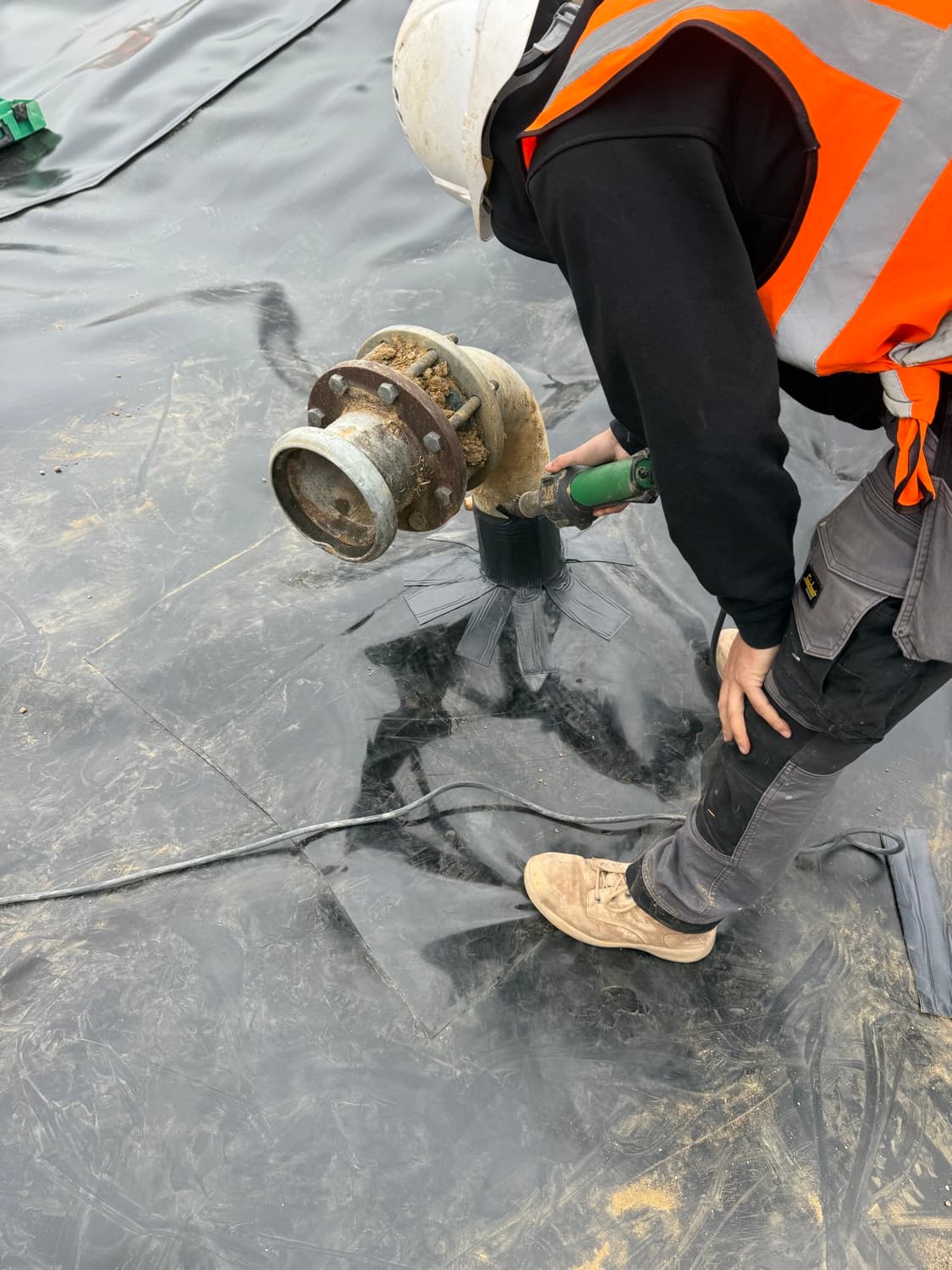 Penetration fitting sealed into the containment membrane at Bognor Regis