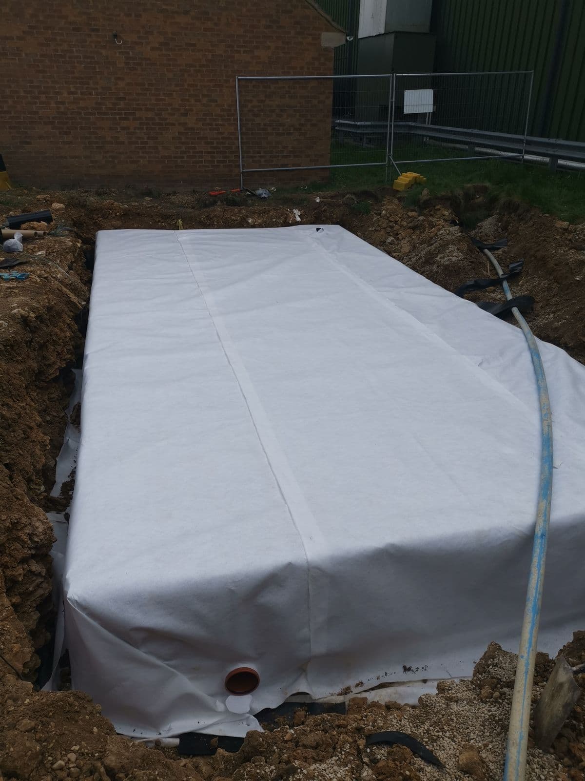 Geotextile wrapped over the tank at RAF Brize Norton