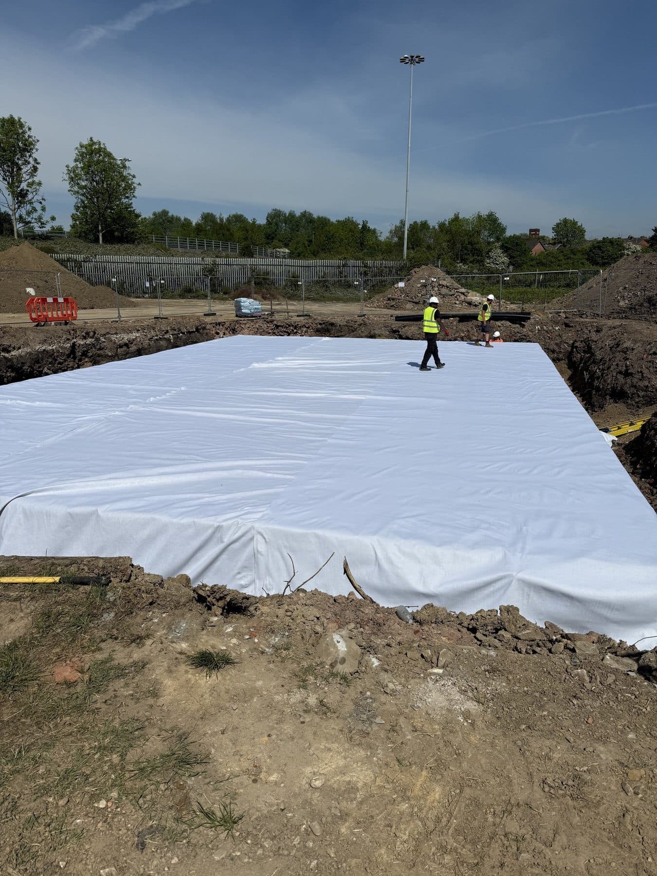 Tank complete under fleece, ready for backfill