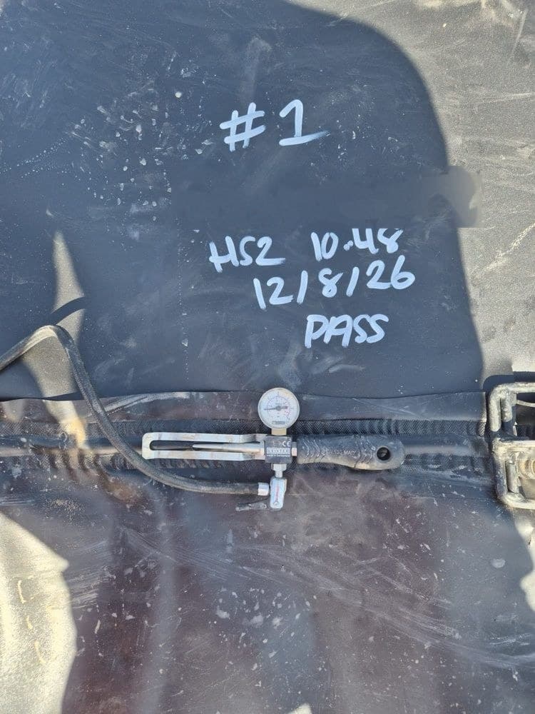 Weld test #1 marked 'HS2 pass' on the pond liner