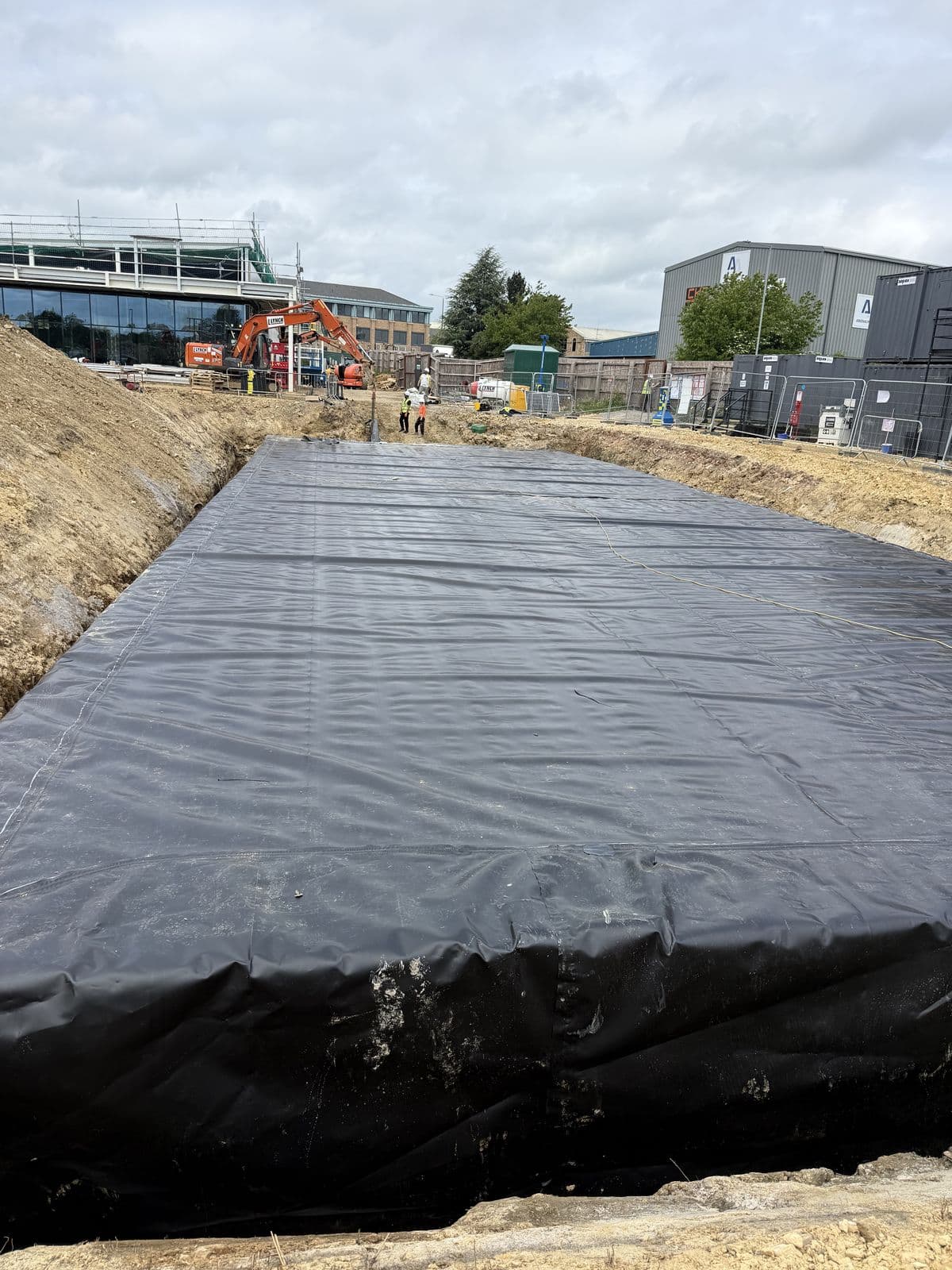 The finished Lidl Corby tank wrapped in welded LLDPE membrane, ready for backfill