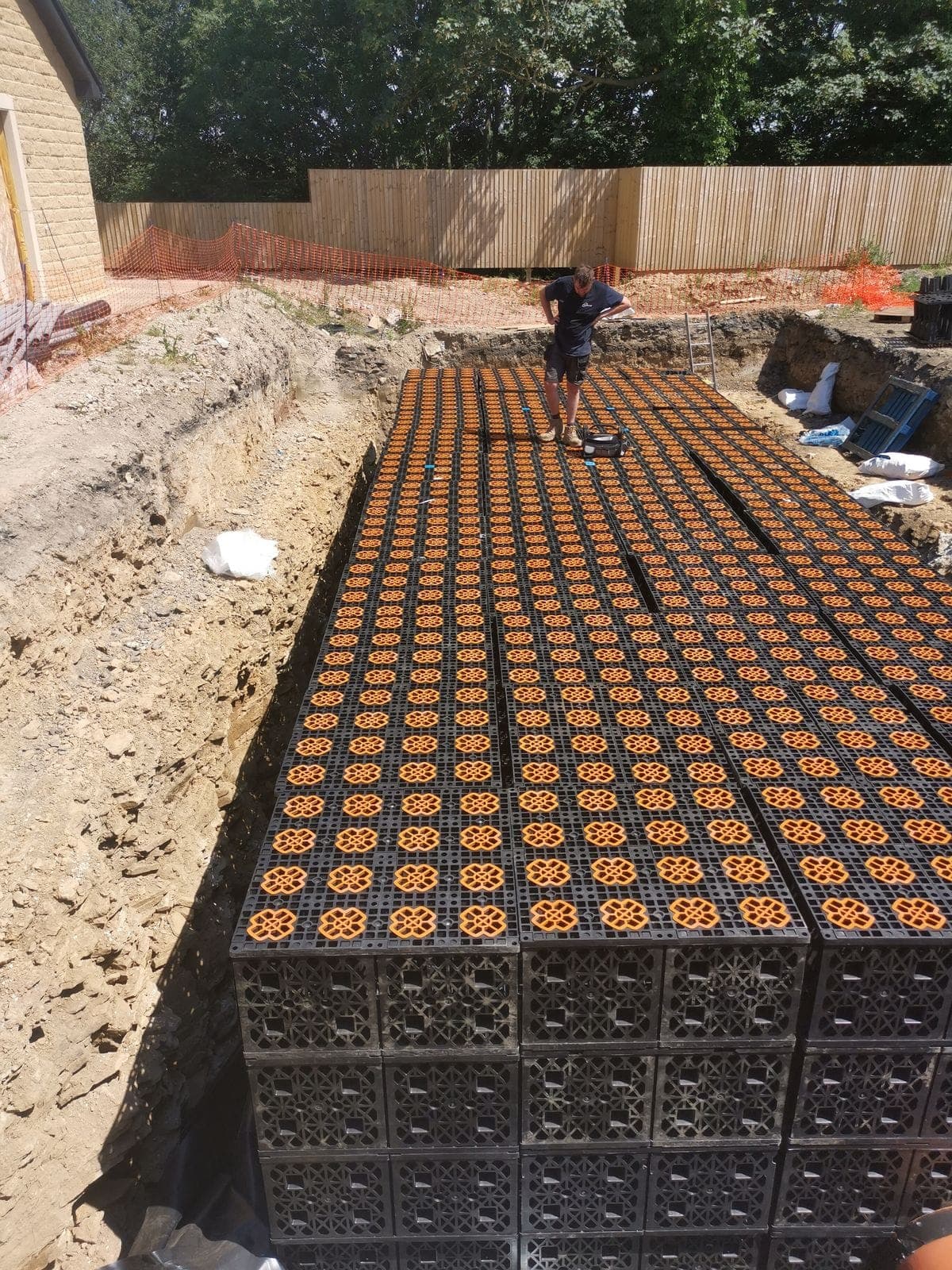 Crates for the 183m³ adoptable storage tank being built up in the 2.5m-deep excavation at Oxspring