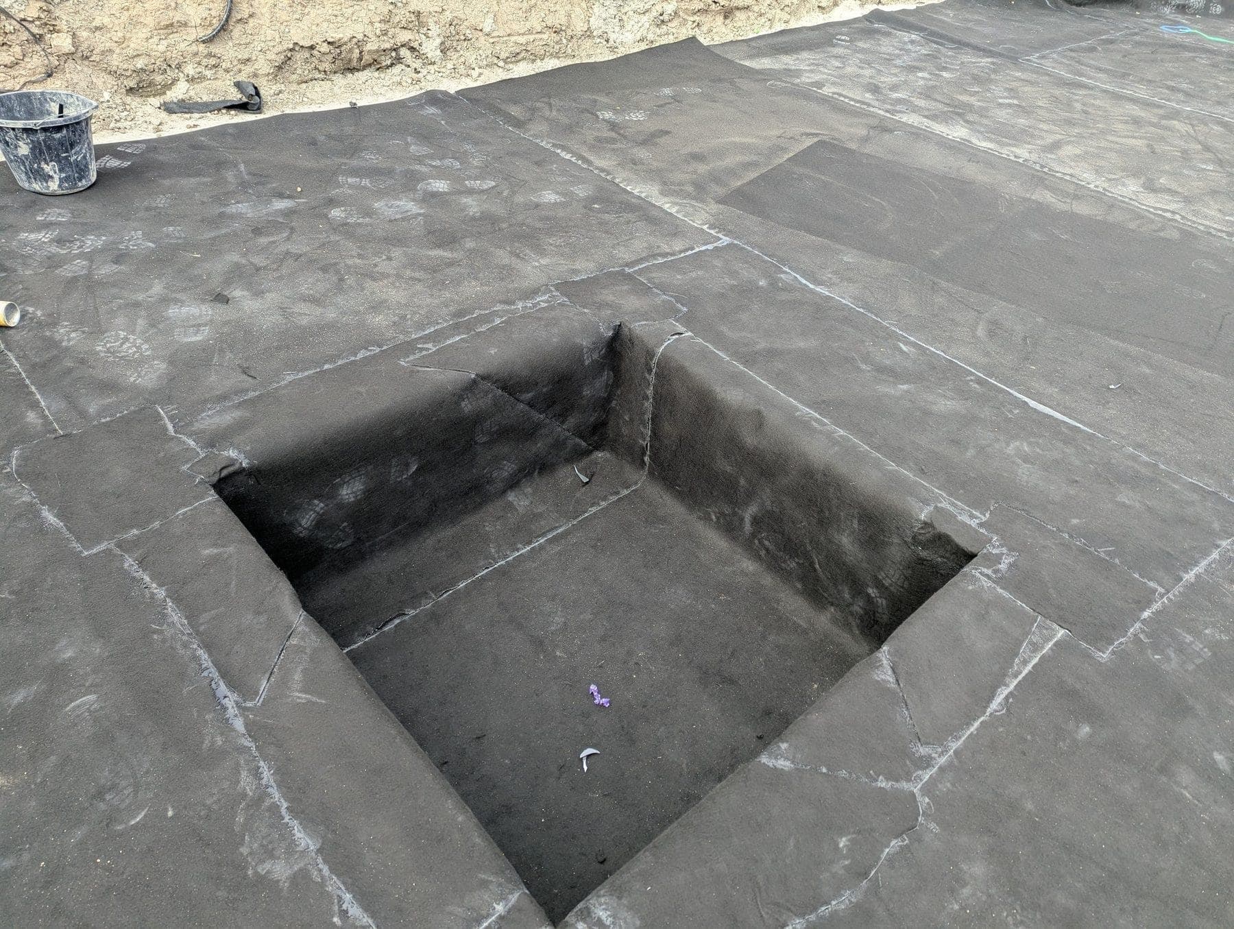 Welded sump formed into the lining
