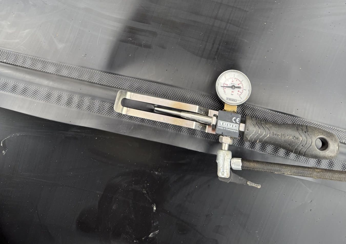 Weld pressure-test · gauge on the seam