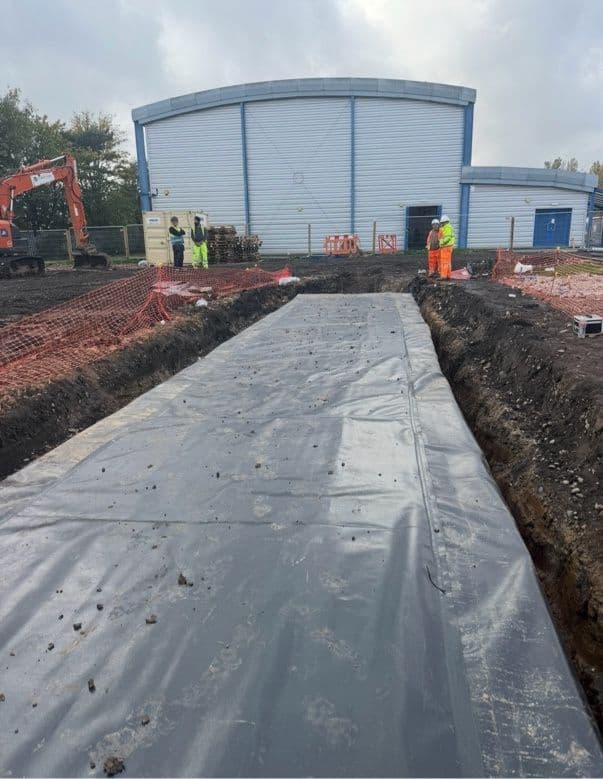 Powerscrim liner laid along the 32m tank trench at Swanhurst School